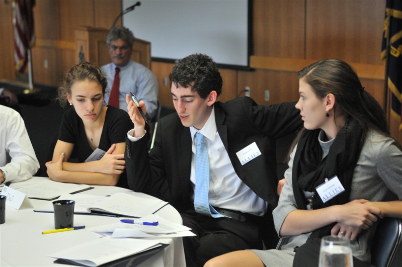 students discuss at round table